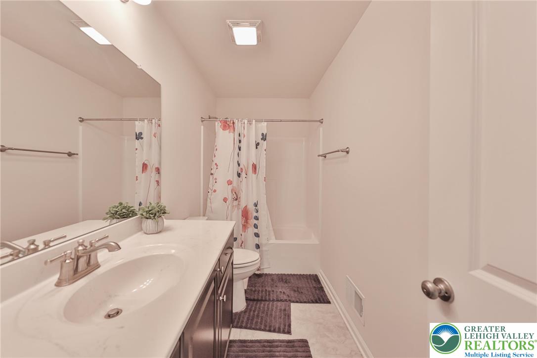 338 Abby Road Macungie, PA 18062 - Photo 38 of 40 a bathroom with a sink a mirror and shower