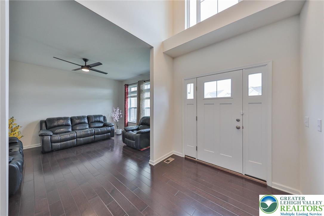 338 Abby Road Macungie, PA 18062 - Photo 6 of 40 a living room with furniture and a wooden floor