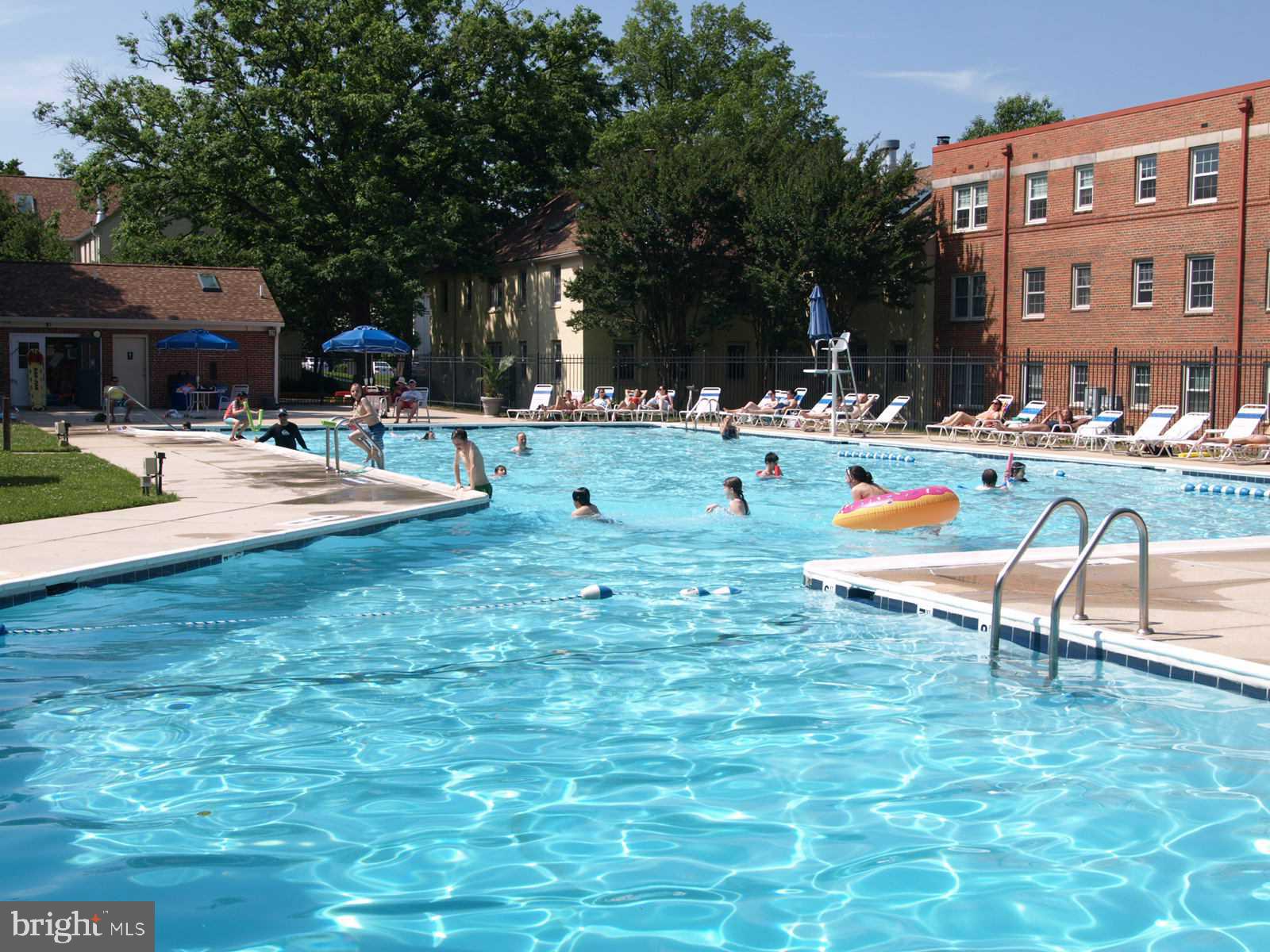 2214 Washington Avenue, Unit 204 Silver Spring, MD 20910 - Photo 19 of 32 a view of a swimming pool with outdoor seating