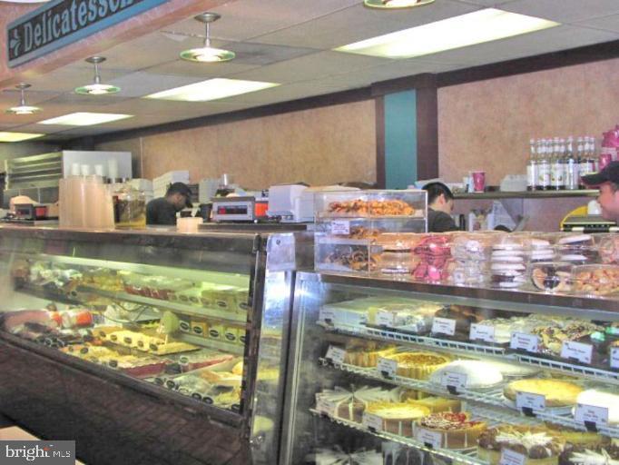 2214 Washington Avenue, Unit 204 Silver Spring, MD 20910 - Photo 23 of 32 a room with stainless steel appliances lots of fruit and kitchen view