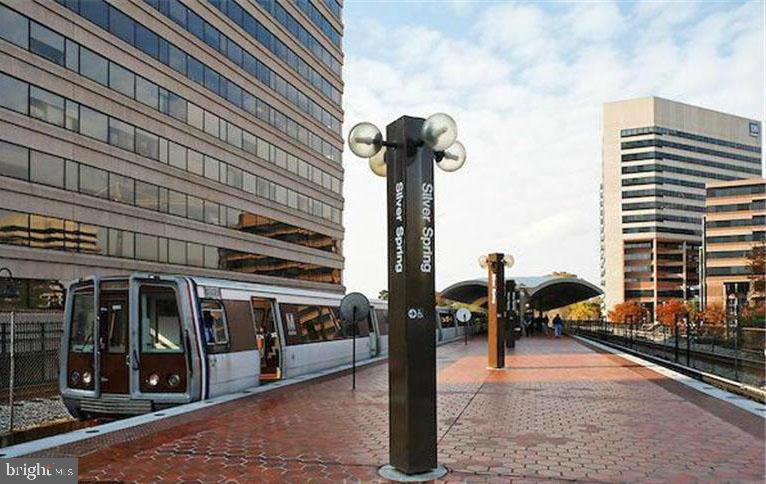 2214 Washington Avenue, Unit 204 Silver Spring, MD 20910 - Photo 29 of 32 a view of a patio with table and chairs