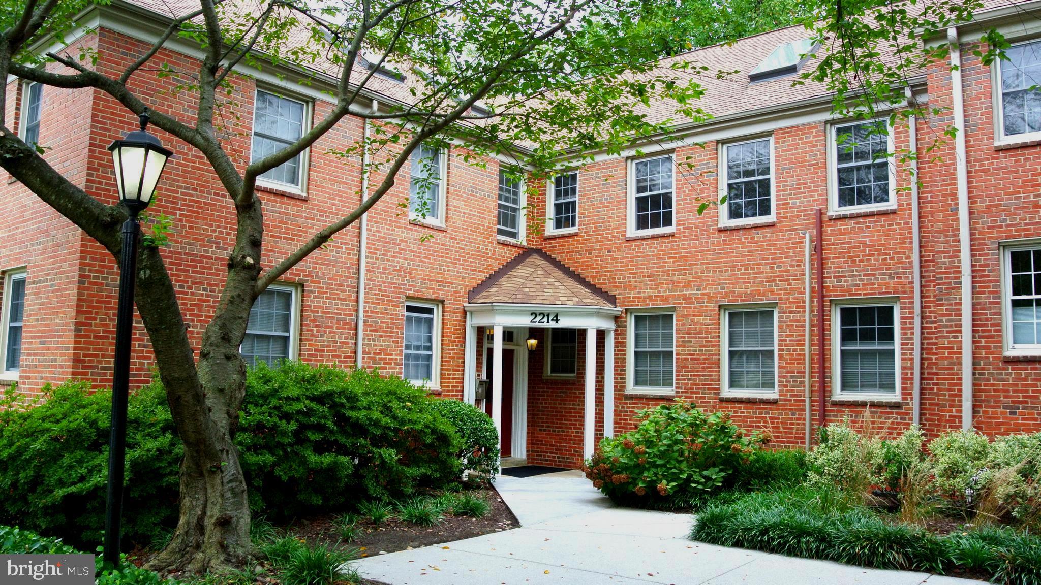 2214 Washington Avenue, Unit 204 Silver Spring, MD 20910 - Photo 3 of 32 a front view of a house with yard and green space