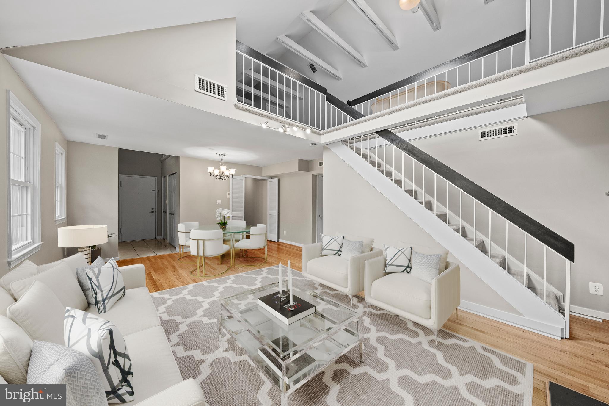2214 Washington Avenue, Unit 204 Silver Spring, MD 20910 - Photo 7 of 32 a living room with furniture and wooden floor