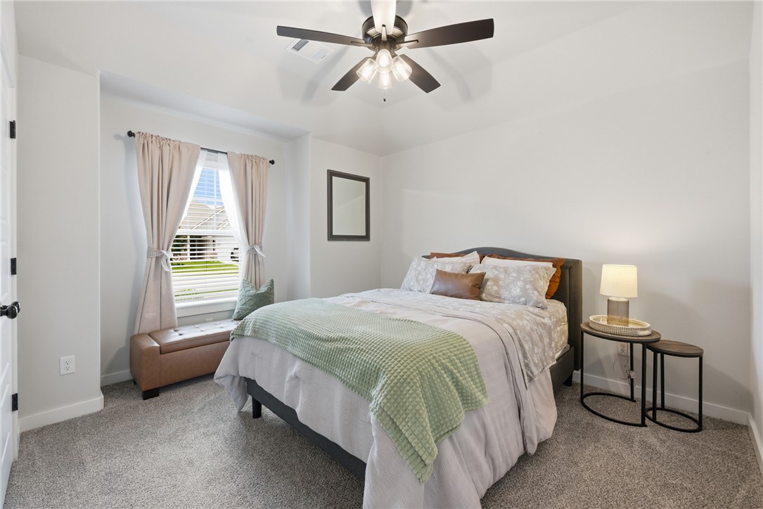 3112 Margaret Rudder Parkway Bryan, TX 77808 - Photo 17 of 24 a bedroom with a bed and window