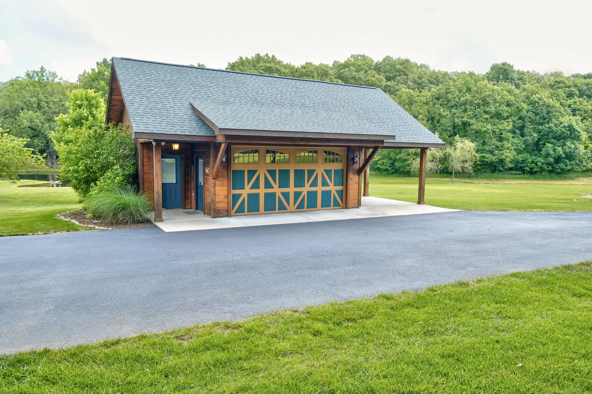 3210 Thompson Road Murfreesboro, TN 37128 - Photo 38 of 42 Two car garage with carport and built in storage shed.