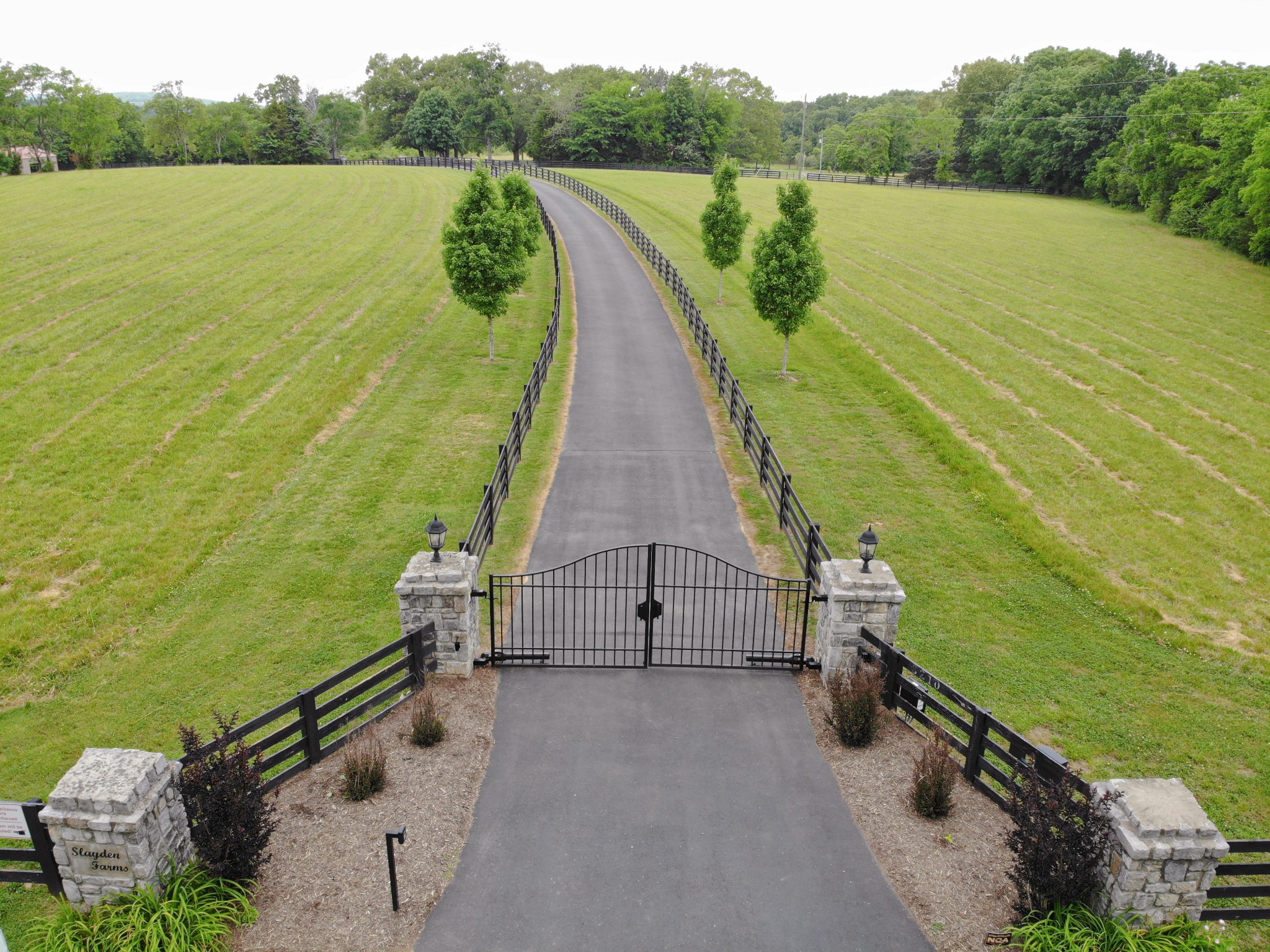A secure gate welcomes you and your guests down the long, private drive.