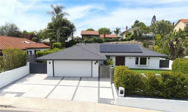 a house view with a garden space