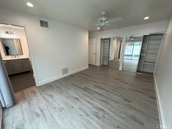a view of livingroom with hardwood floor and a ceiling fan