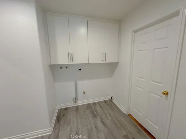a view of room with wooden floor