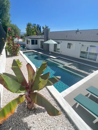 a view of a swimming pool with a patio