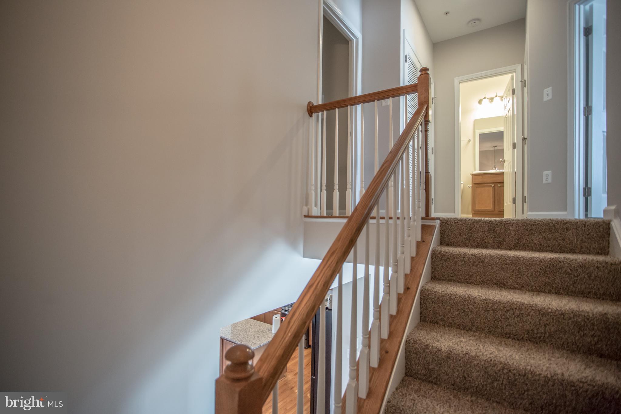 2804 Admiral Ridge Road Accokeek, MD 20607 - Photo 17 of 30 Stairwell w/ new carpet leads up to bedroom wing