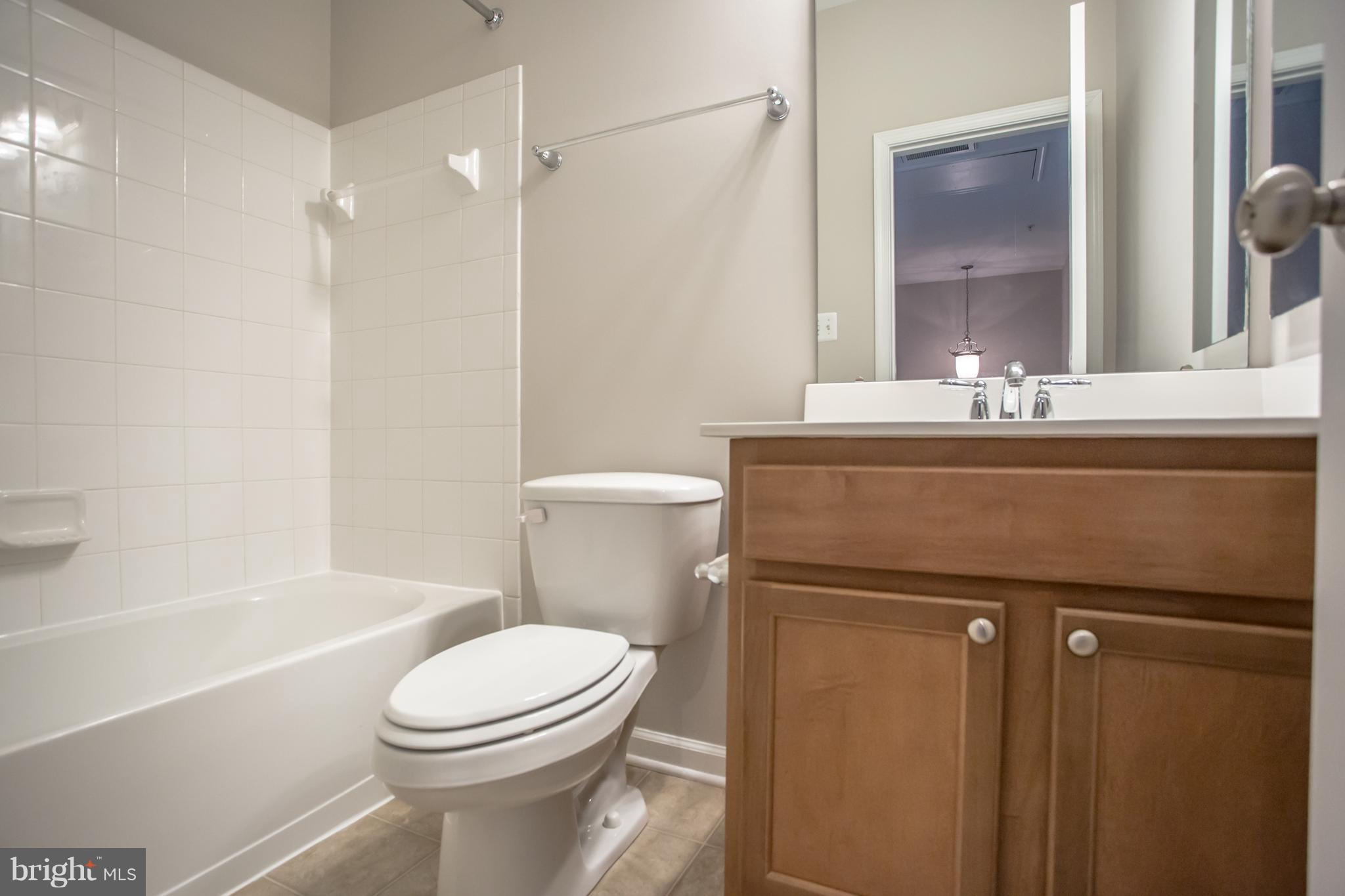 2804 Admiral Ridge Road Accokeek, MD 20607 - Photo 27 of 30 Full hall BA w/ maple vanity on uppermost level