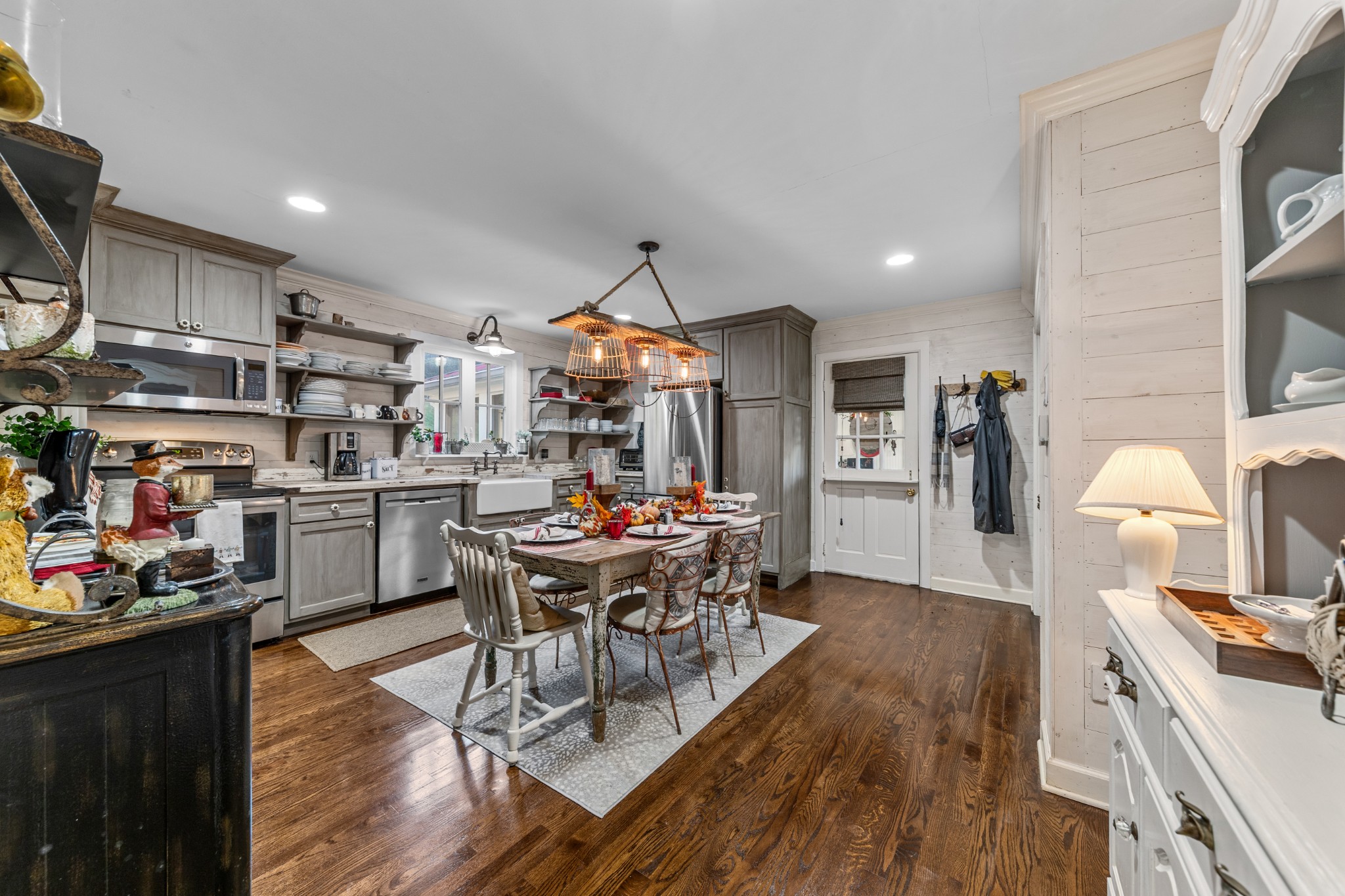 3580 Blue Creek Road Lynnville, TN 38472 - Photo 25 of 90 a kitchen view with stainless steel appliances wooden floor dining table and chairs