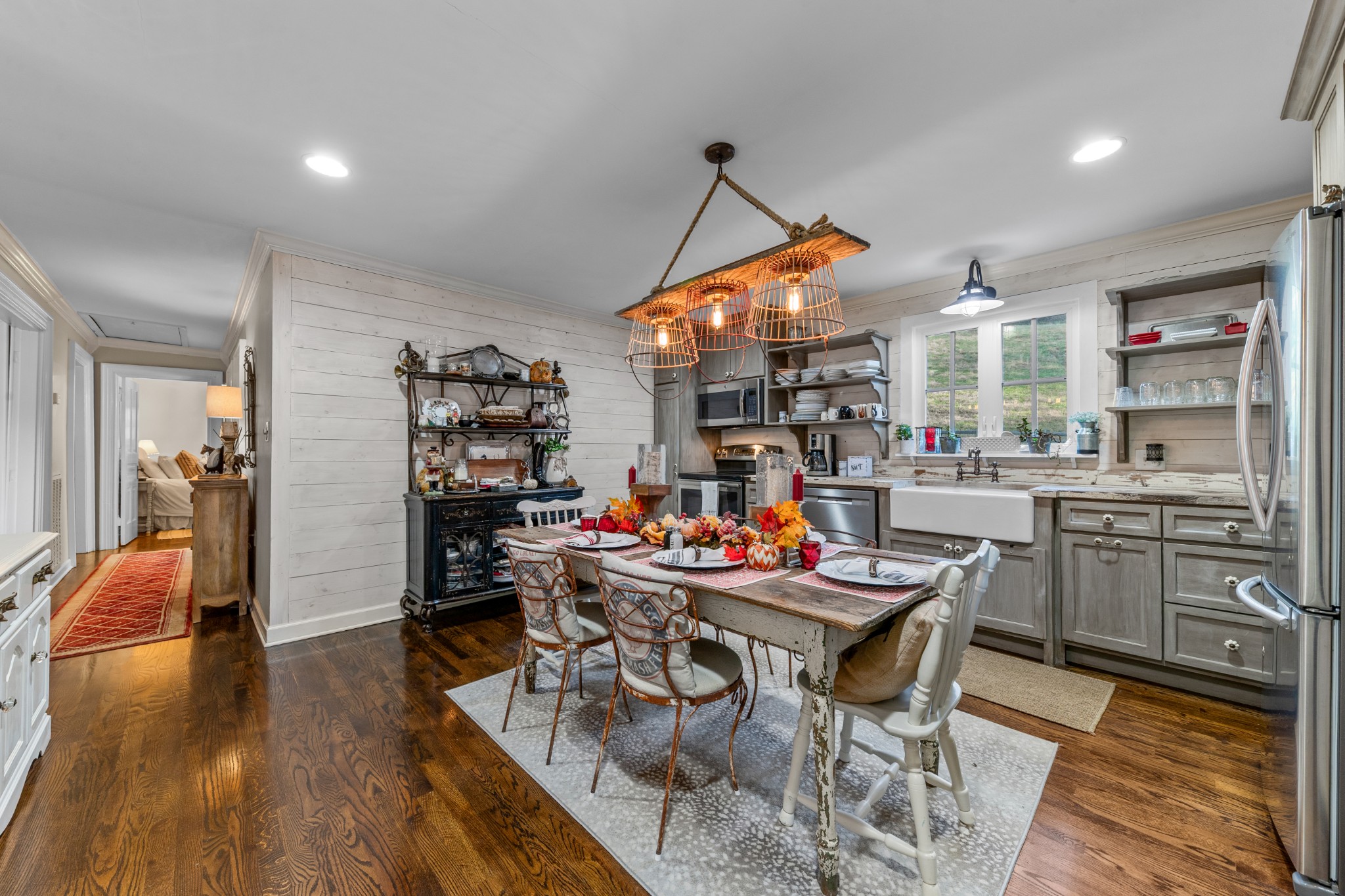 3580 Blue Creek Road Lynnville, TN 38472 - Photo 27 of 90 a view of a dining room and livingroom with furniture wooden floor a chandelier