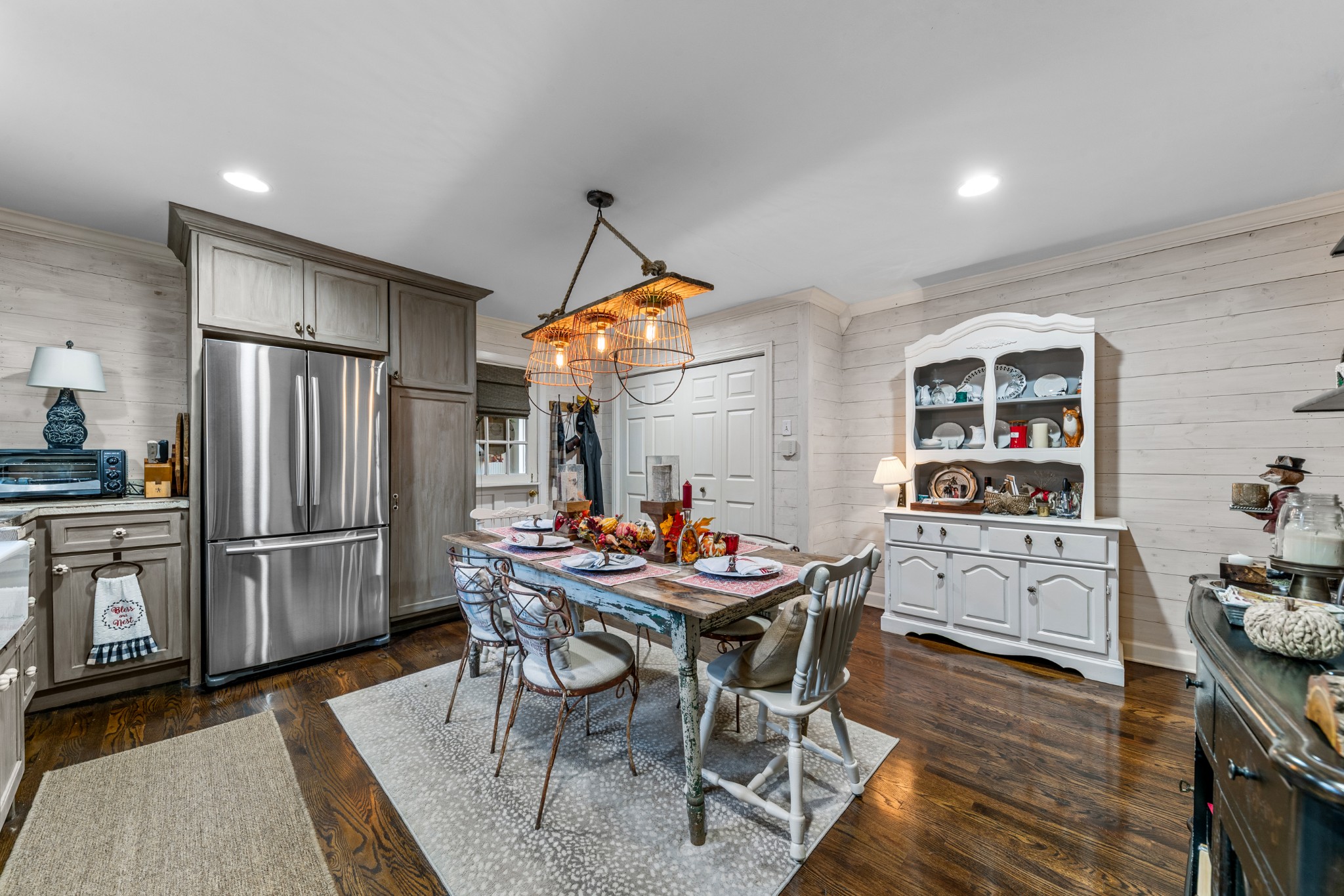 3580 Blue Creek Road Lynnville, TN 38472 - Photo 29 of 90 a kitchen with stainless steel appliances kitchen island granite countertop a refrigerator a stove a dining table and chairs with wooden floor
