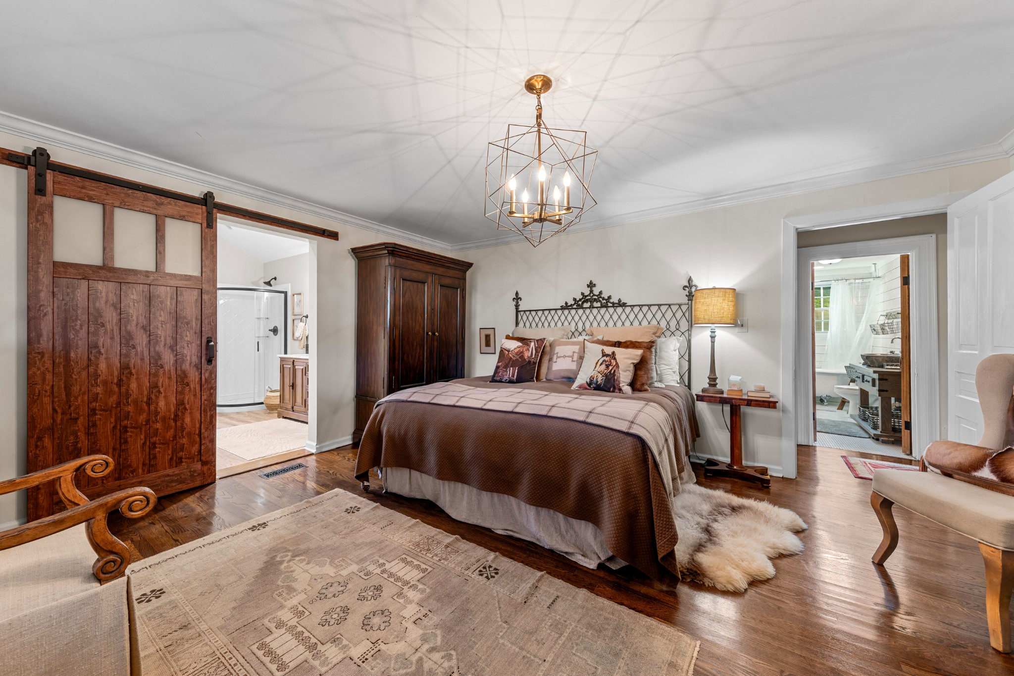 3580 Blue Creek Road Lynnville, TN 38472 - Photo 35 of 90 a bed room with a bed and a chandelier