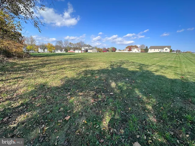 a view of a big yard with an outdoor space