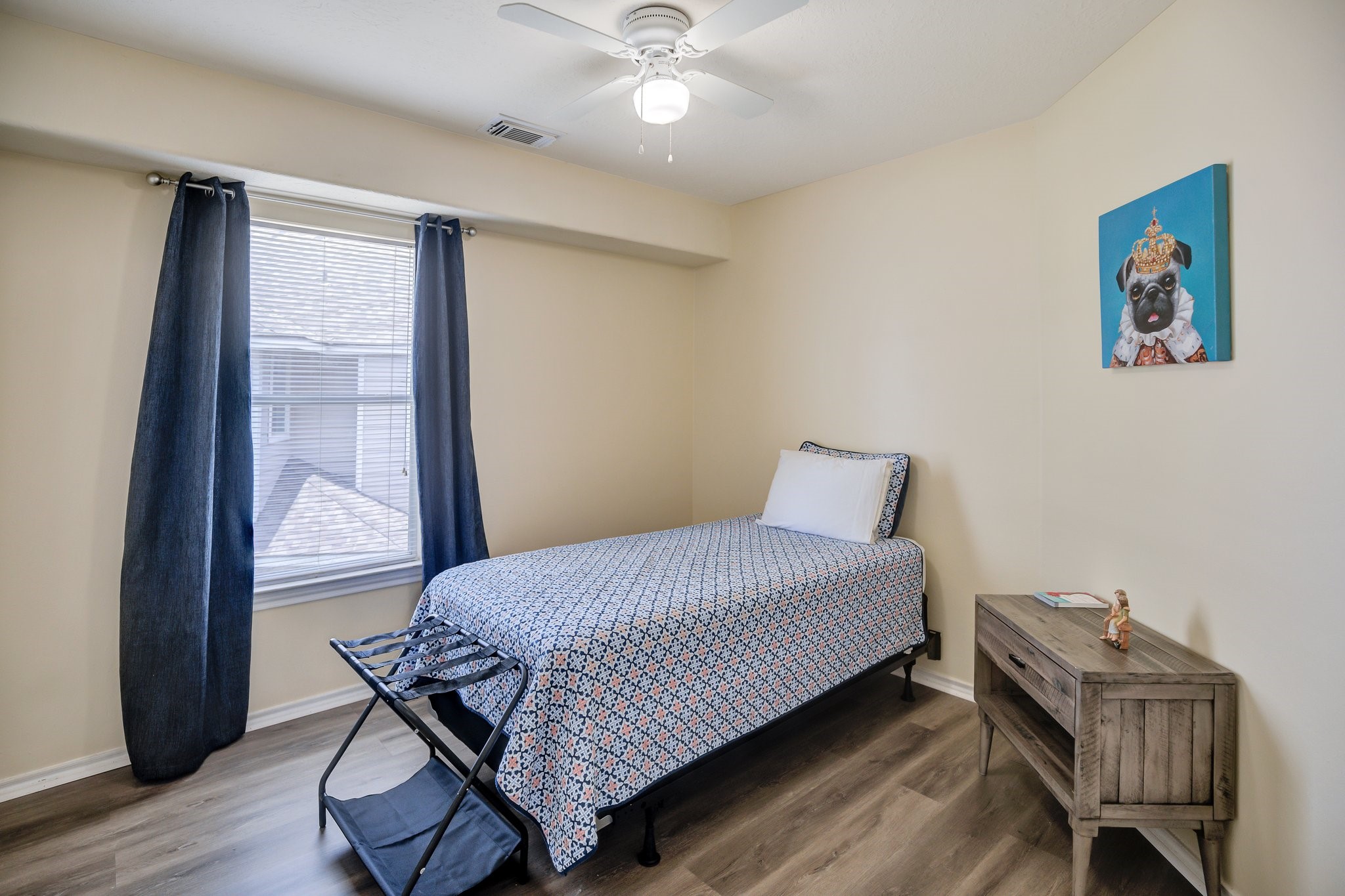 13011 Peppergate Lane Houston, TX 77044 - Photo 12 of 22 a bedroom with a bed and wooden floor