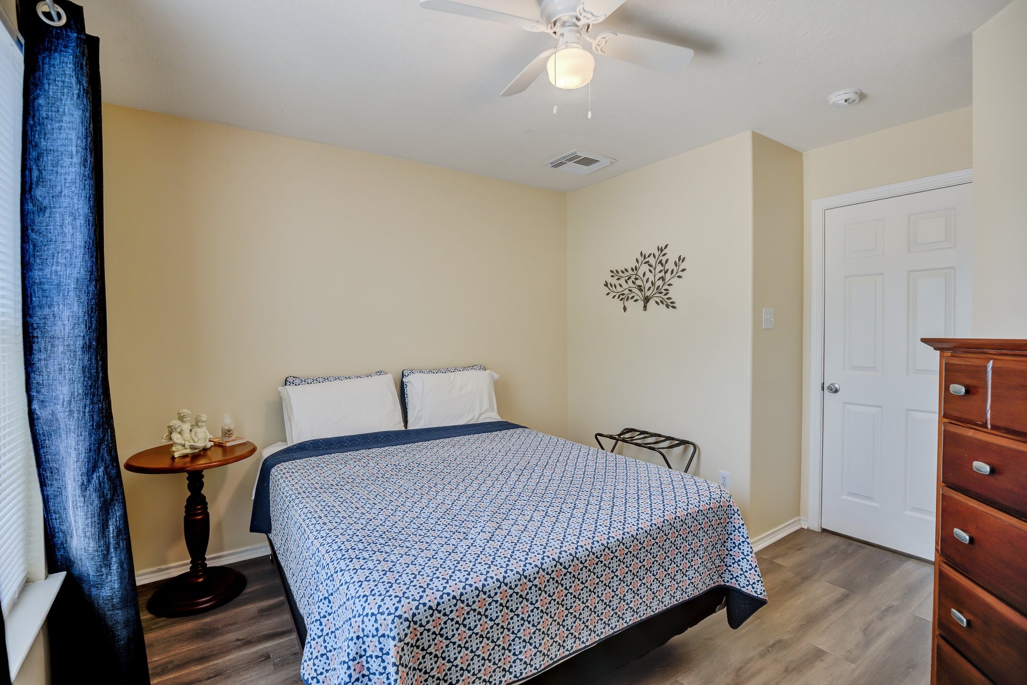 13011 Peppergate Lane Houston, TX 77044 - Photo 14 of 22 a bedroom with a bed and wooden floor