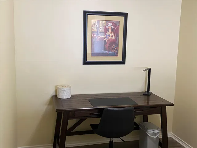 a view of a workspace with furniture