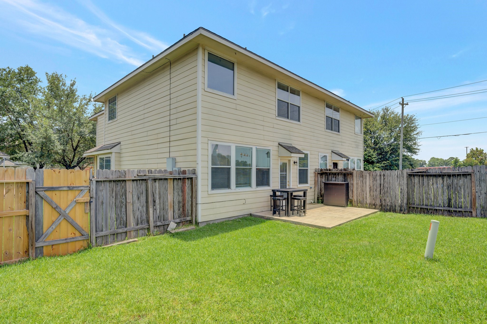 13011 Peppergate Lane Houston, TX 77044 - Photo 21 of 22 a view of backyard with a chair and table in the patio