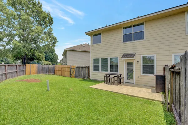 a house view with a sitting space and garden