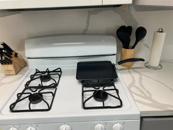 a view of staircase with a view of living room