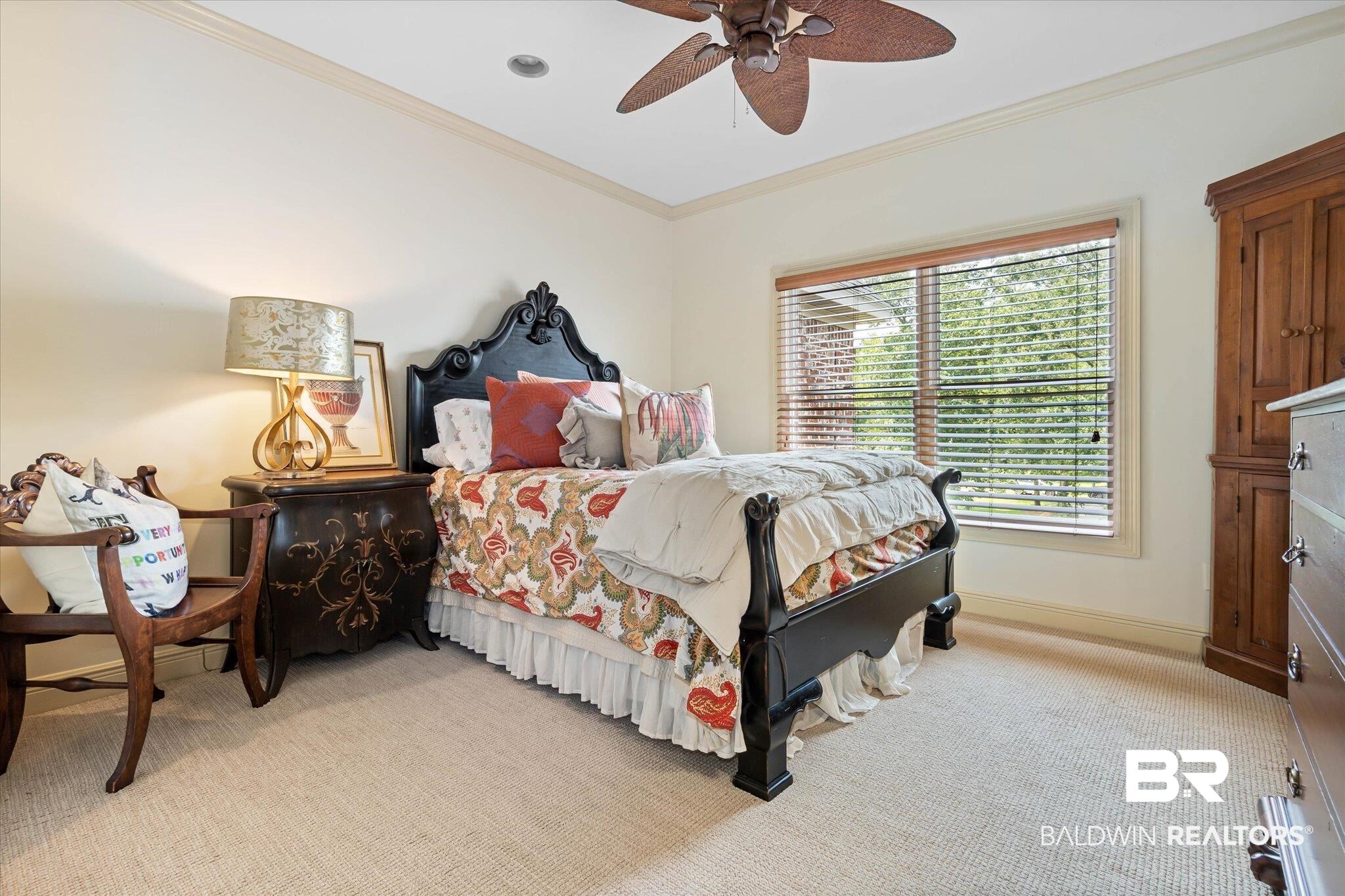 2905 Riverview Pointe Drive South Theodore, AL 36582 - Photo 21 of 44 Bedroom featuring ornamental molding, light colored carpet, and a ceiling fan