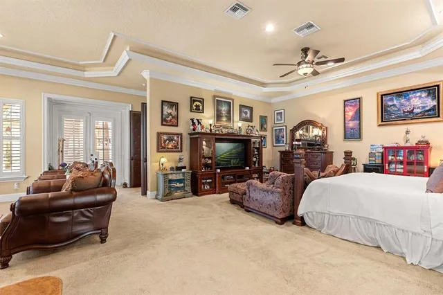 a living room with lots of furniture and a large window