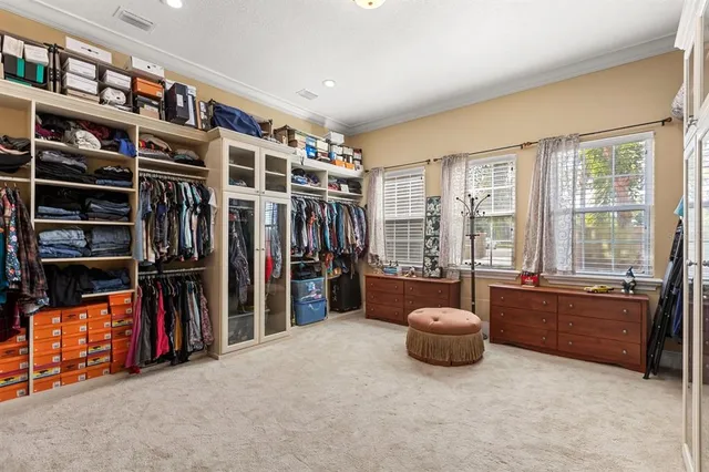 a bathroom with a tub a sink and a mirror