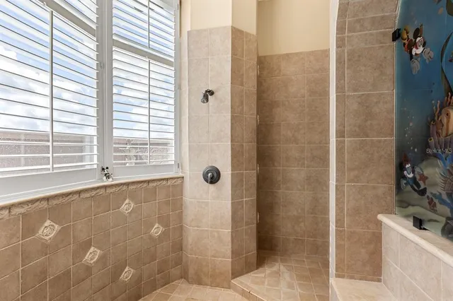 a living room with furniture a rug and white walls