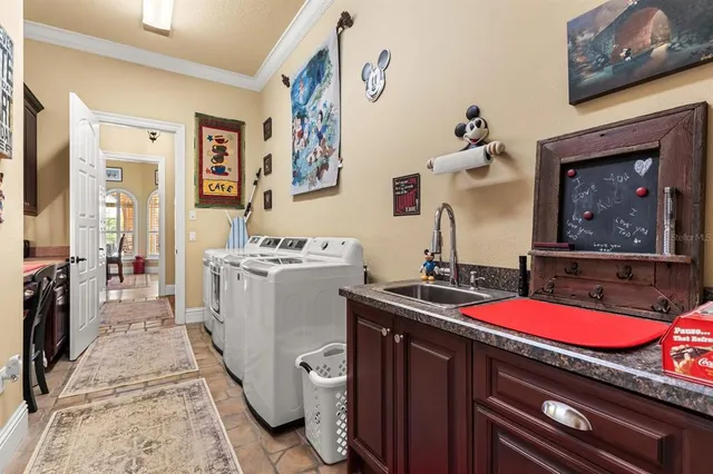 a spacious bathroom with a bathtub a double vanity and a sink
