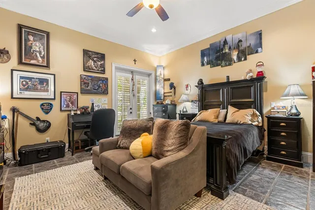 a living room with fireplace furniture and a large window