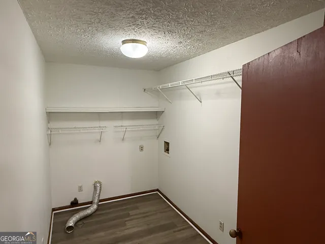 a view of a room with racks on the wall