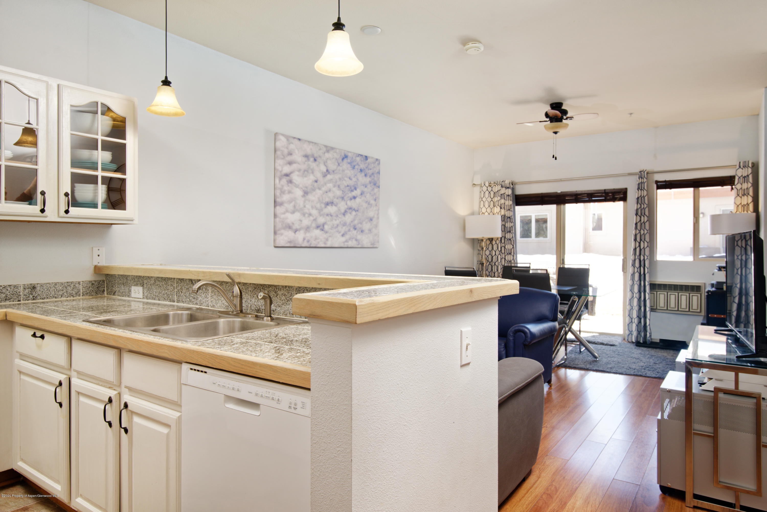 1400 East Valley Road, Unit 110 Basalt, CO 81621 - Photo 4 of 10 a kitchen with a sink cabinets and wooden floor