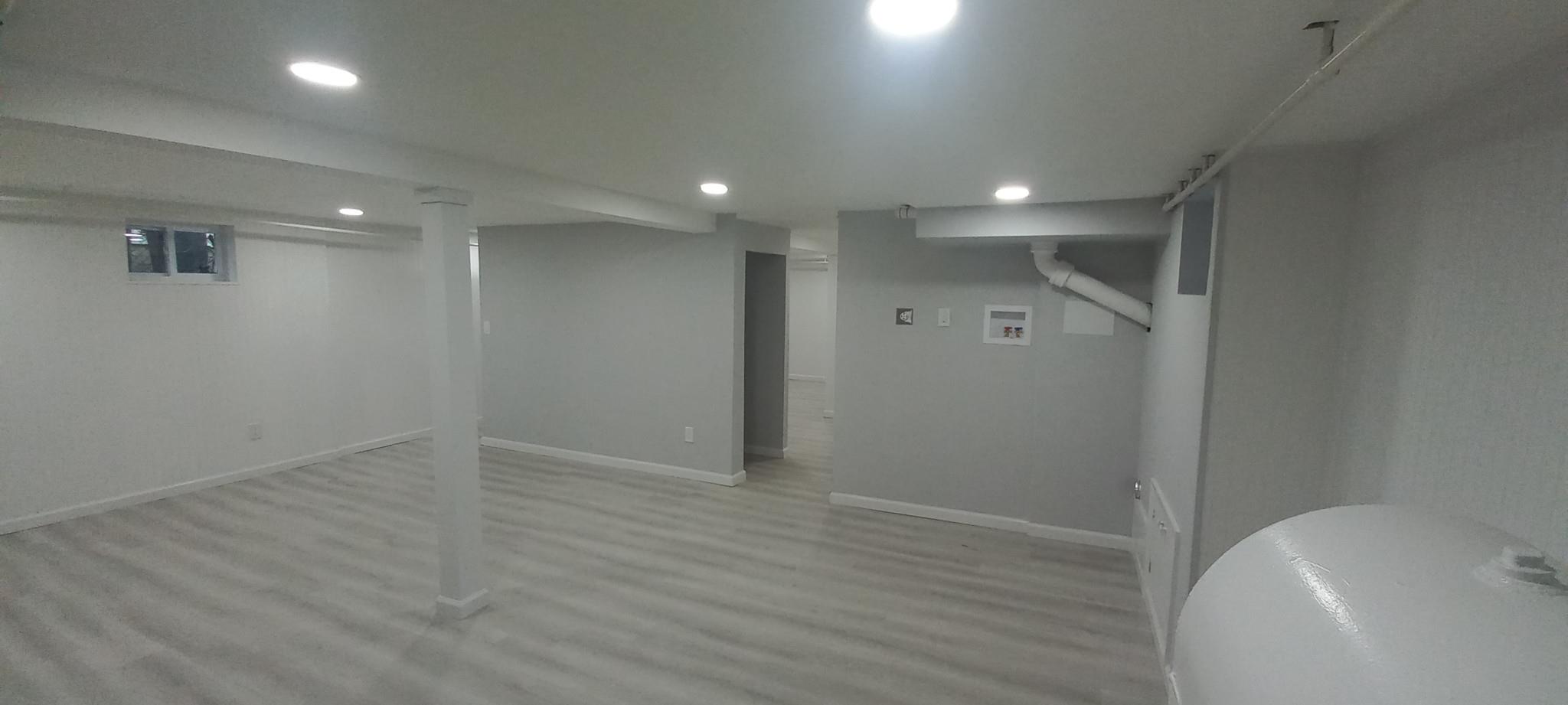 3 Hampton Road Lynbrook, NY 11563 - Photo 12 of 23 Finished below grade area featuring light wood-style flooring, baseboards, and recessed lighting