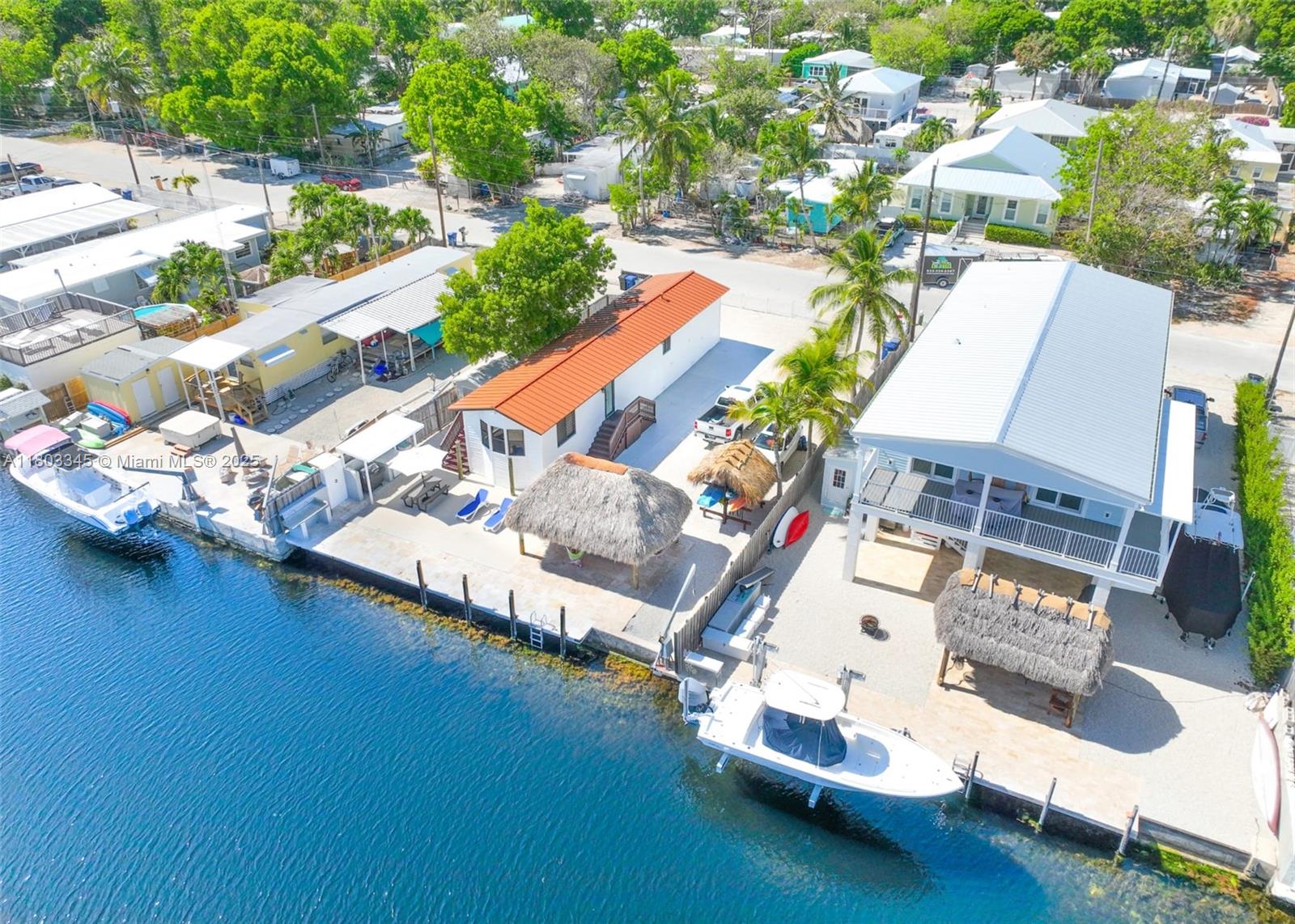 an aerial view of residential house with outdoor space and swimming pool