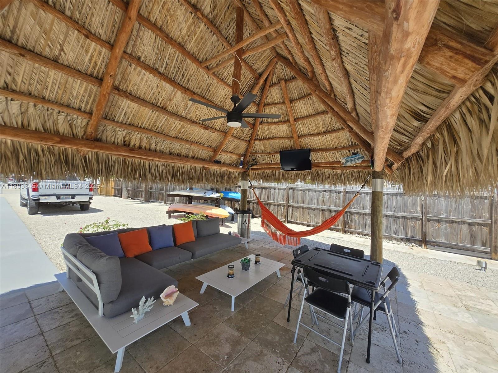 271 Lance Lane Key Largo, FL 33037 - Photo 11 of 33 a view of a patio with a table and chairs