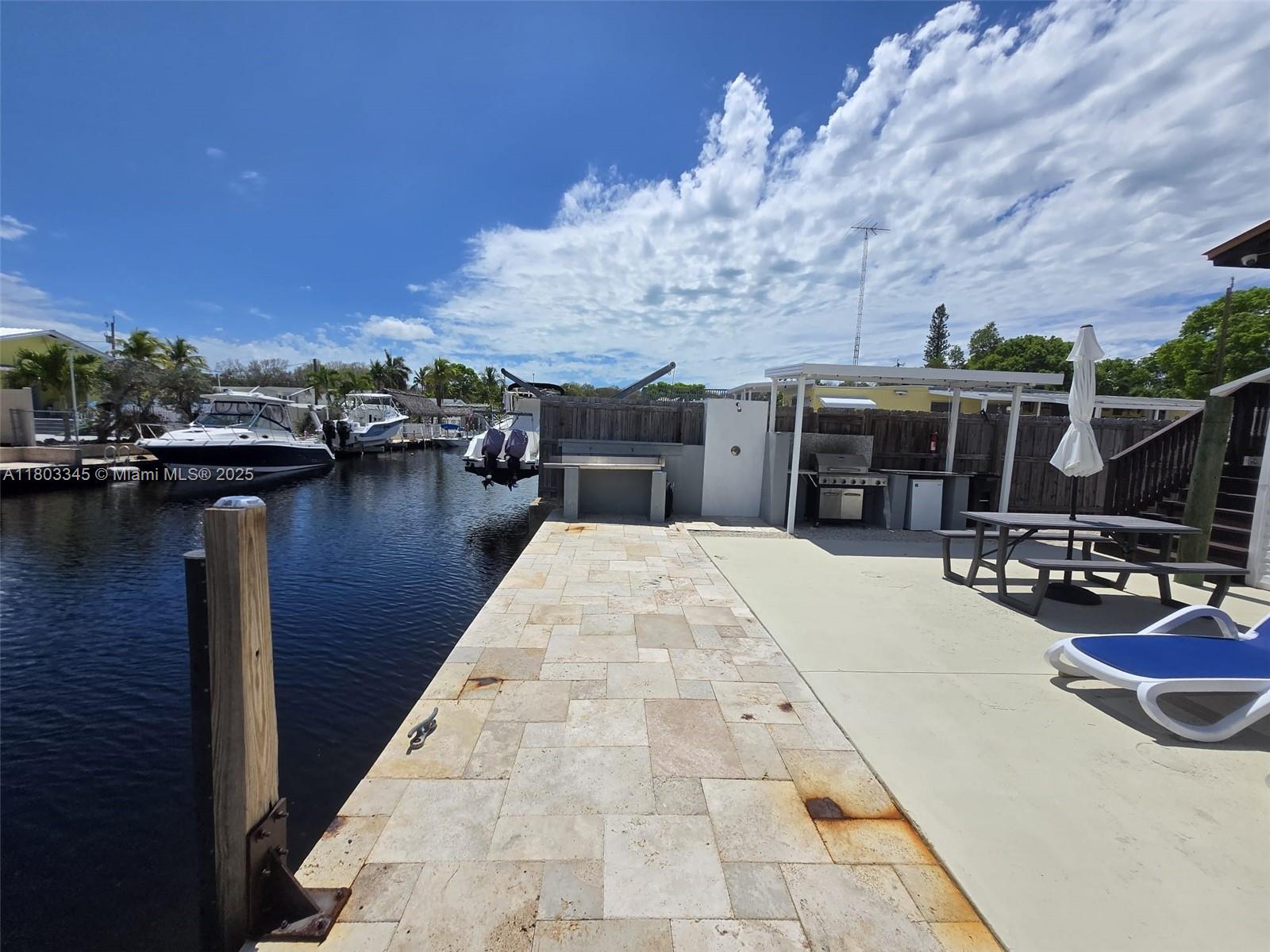 271 Lance Lane Key Largo, FL 33037 - Photo 14 of 33 a view of outdoor space with seating area and barbeque oven