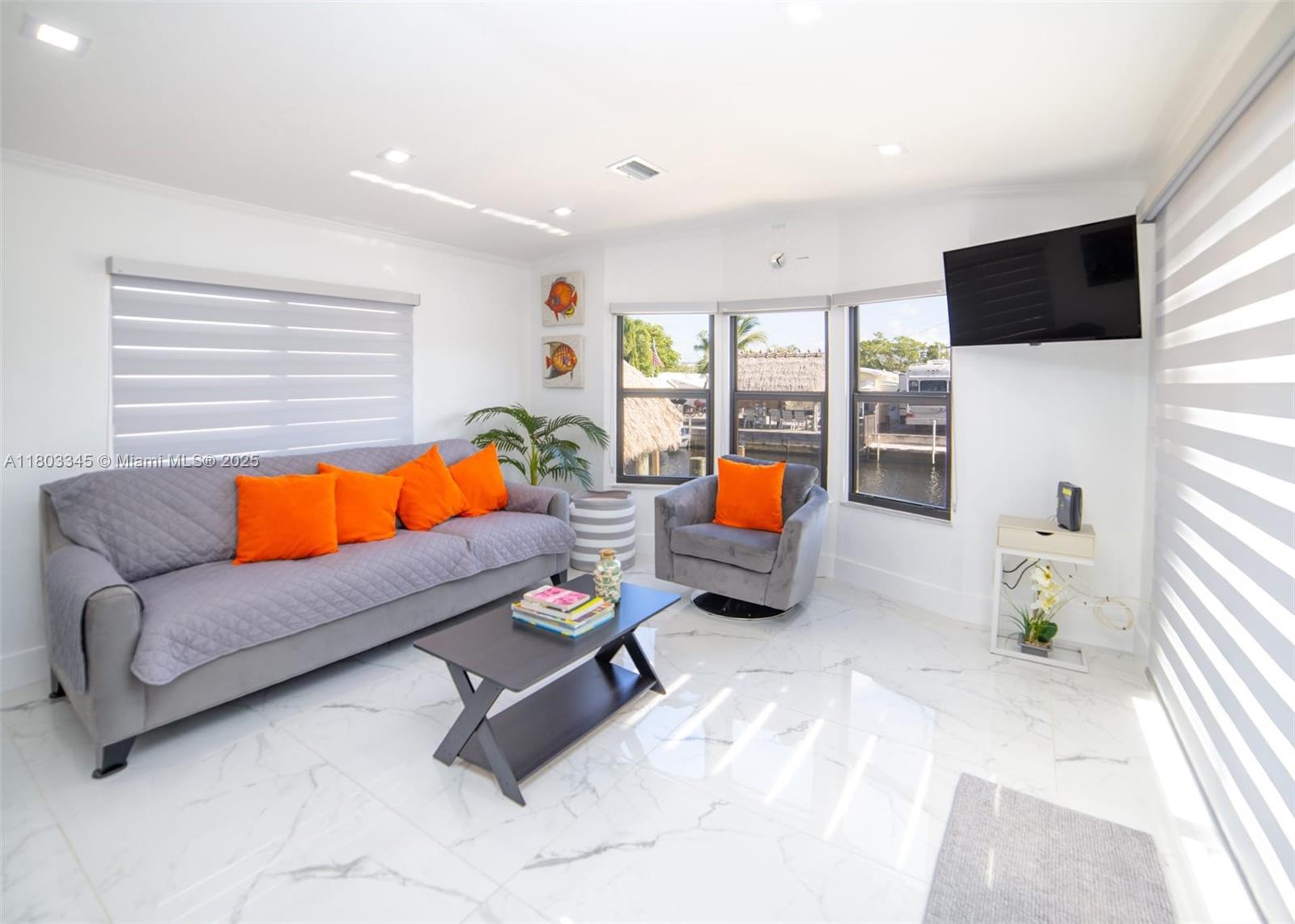 271 Lance Lane Key Largo, FL 33037 - Photo 20 of 33 a living room with furniture and a flat screen tv