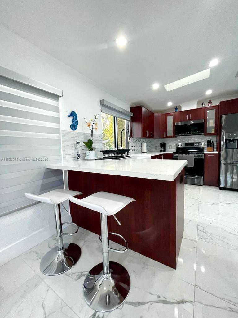 271 Lance Lane Key Largo, FL 33037 - Photo 22 of 33 a kitchen with a sink cabinets and window