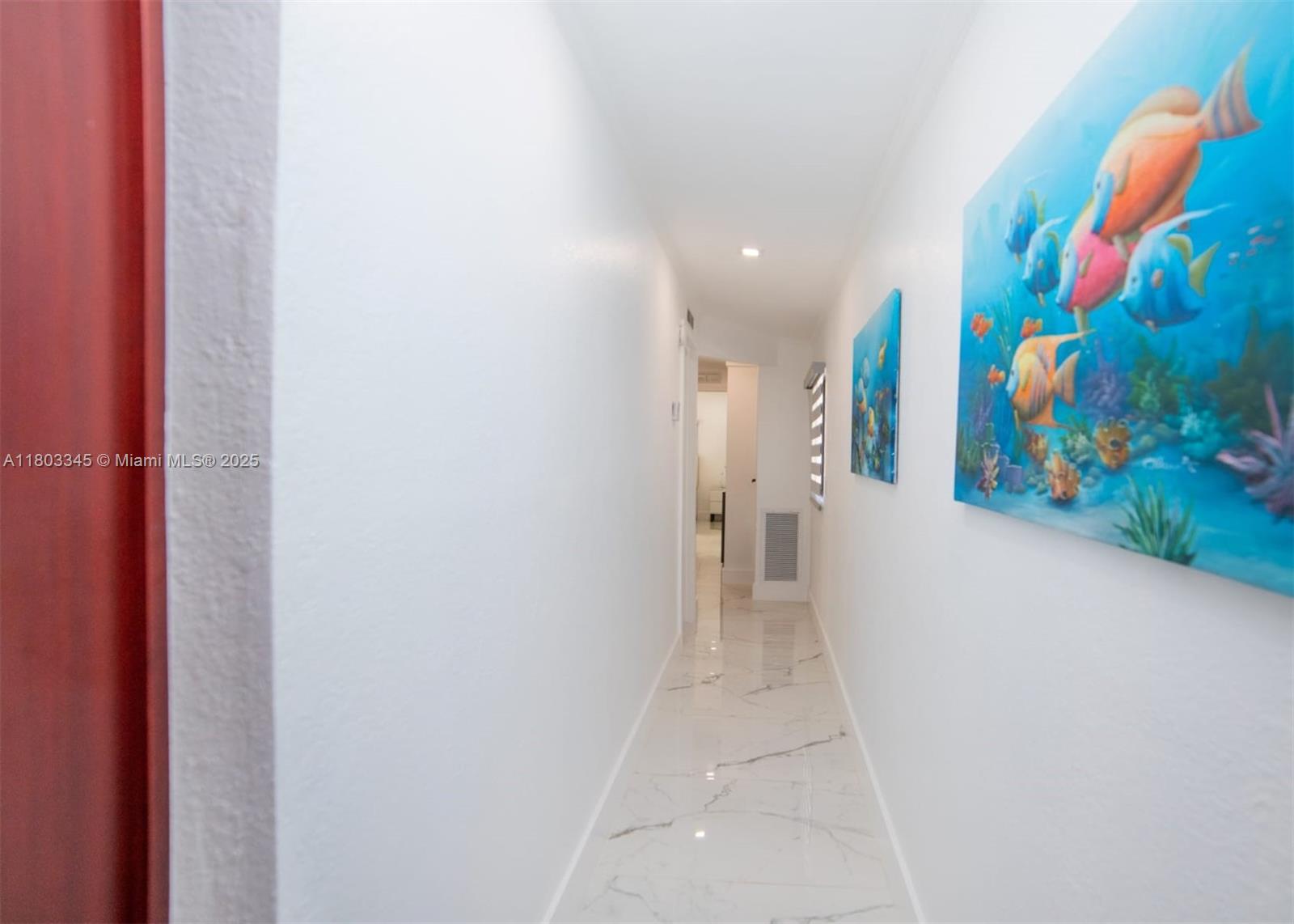 271 Lance Lane Key Largo, FL 33037 - Photo 25 of 33 a view of a hallway with painting on the wall