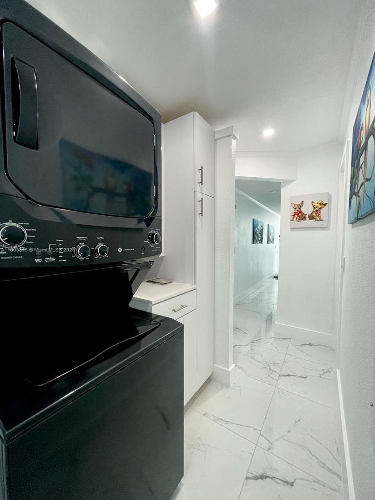 271 Lance Lane Key Largo, FL 33037 - Photo 30 of 33 a kitchen with a refrigerator and a stove top oven