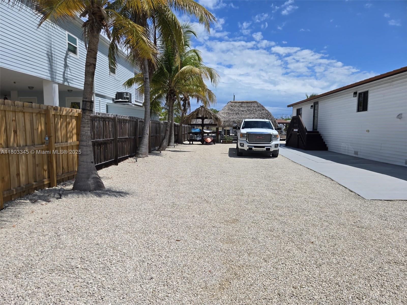 271 Lance Lane Key Largo, FL 33037 - Photo 8 of 33 a car parked in front of a house