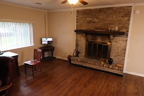 a living room with furniture and a fireplace