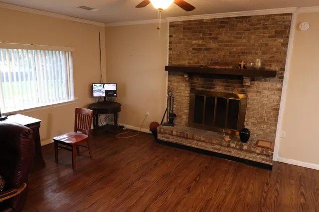 a living room with furniture and a fireplace