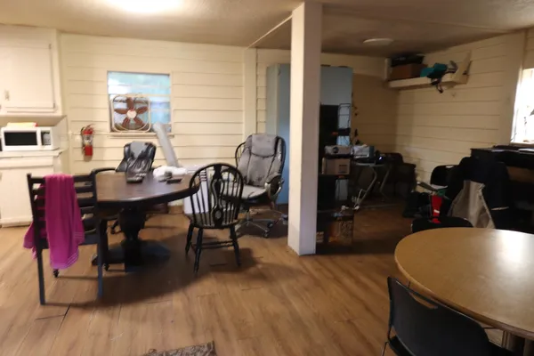 a workspace with furniture and wooden floor