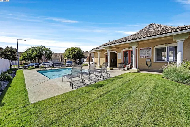 a view of a house with a yard porch and sitting area