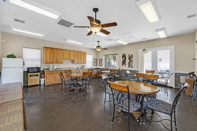 a room with lots of table and chairs