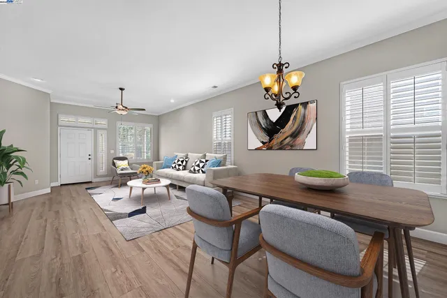 a living room with couches a table and chairs